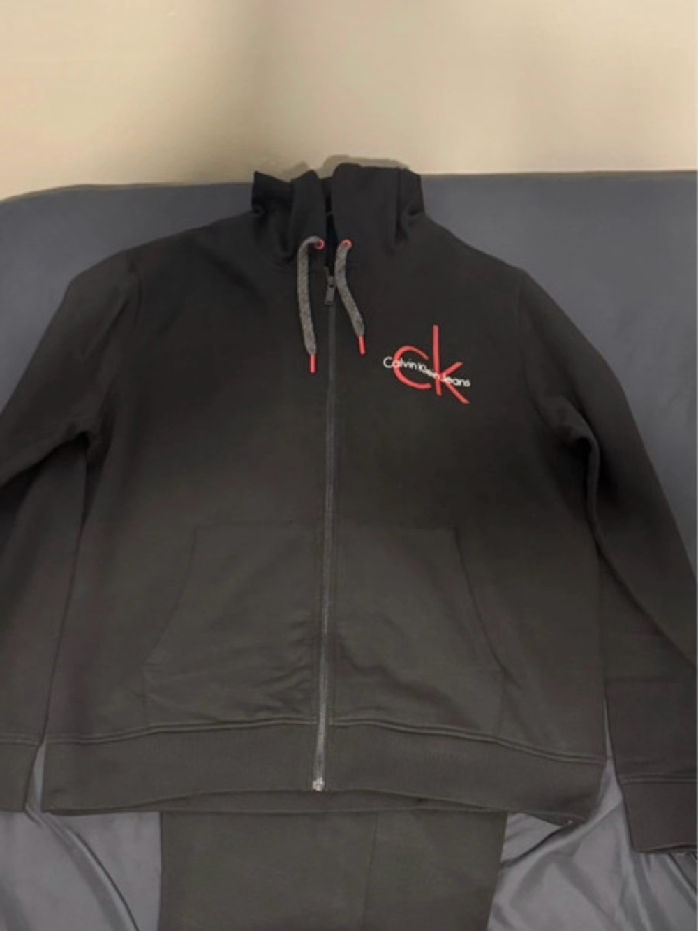 Calvin Klein Jeans Black Zip Hoodie with Red CK Logo